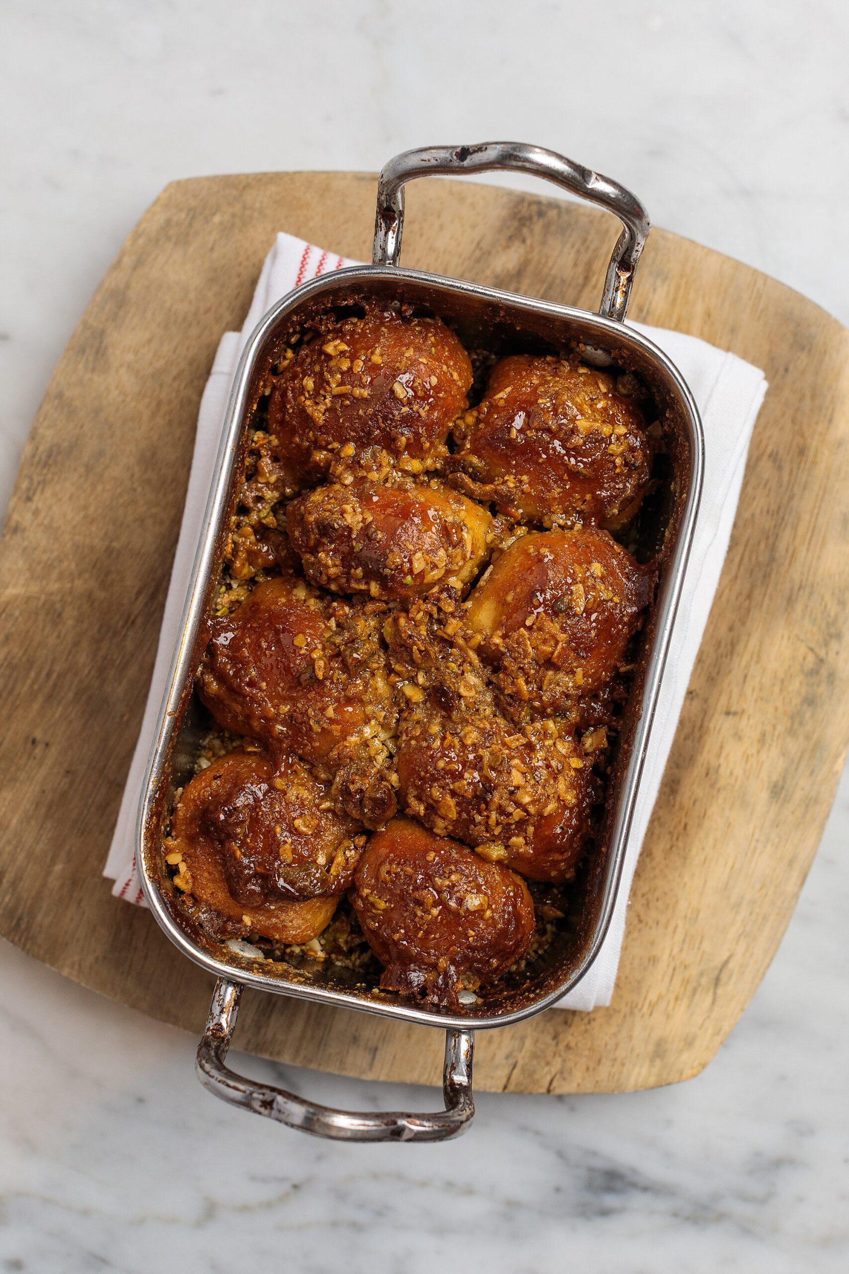 monkeybread in a pan on a wooden serving board